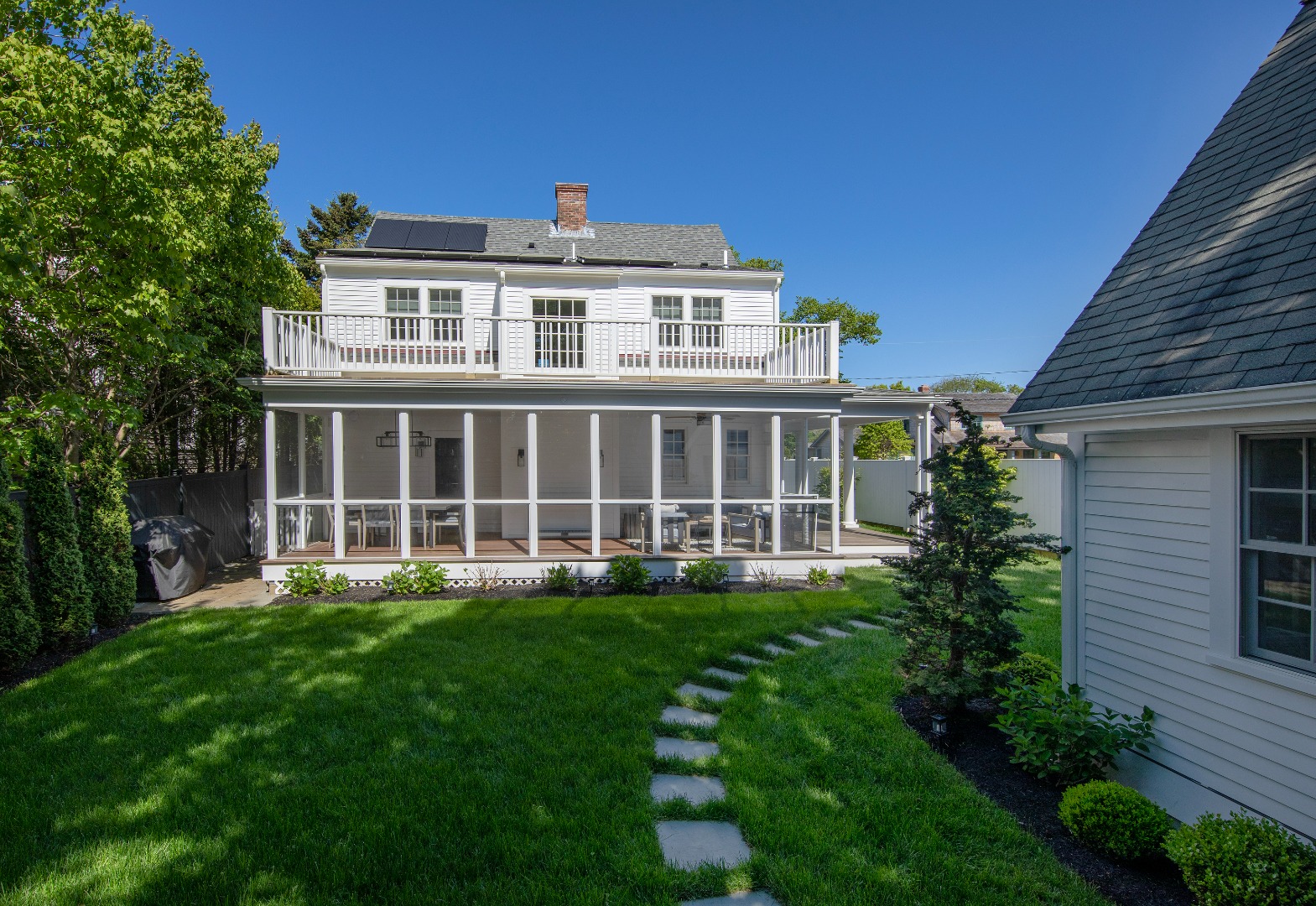 95 School Street Edgartown, MA 02539 - Photo 54 of 57 a large building with a yard