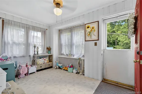 a view of garage with window and furniture