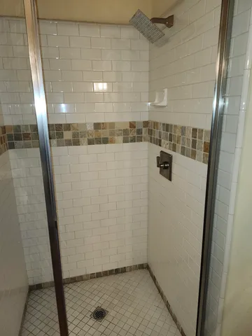 a spacious bathroom with a tub and shower