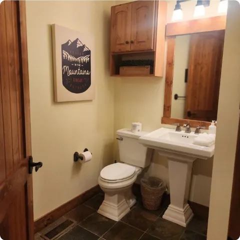 a utility room with cabinets washer and dryer