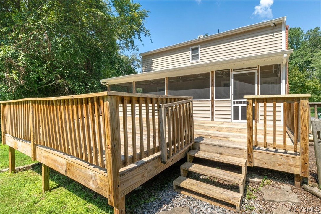 8401 Boones Trail Road Chesterfield, VA 23832 - Photo 18 of 24 a view of a house with backyard and deck