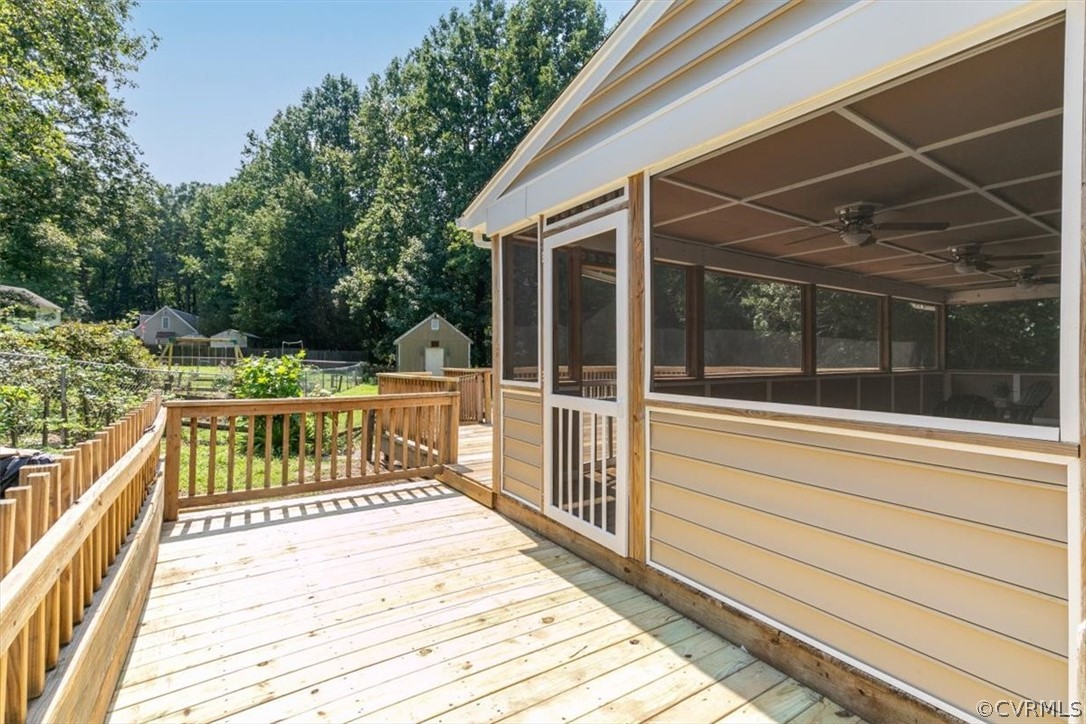8401 Boones Trail Road Chesterfield, VA 23832 - Photo 20 of 24 a view of a balcony with a floor to ceiling window and wooden floor