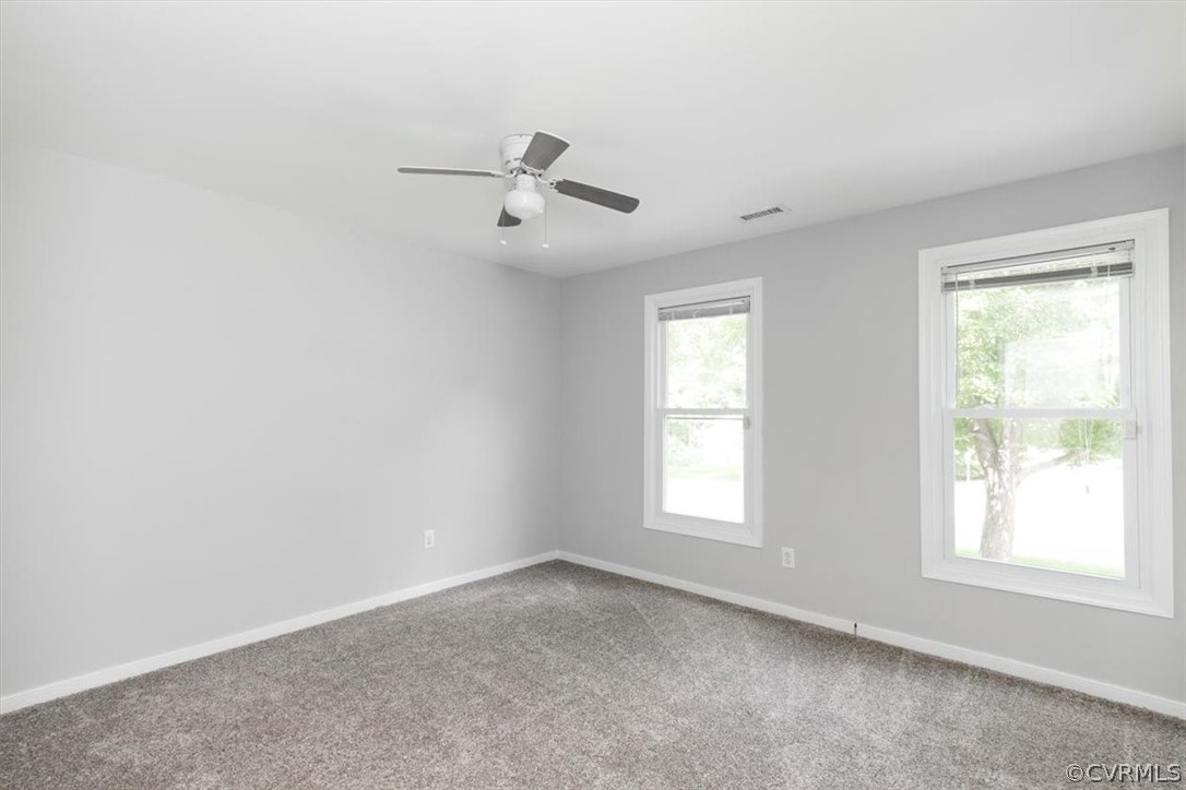 8401 Boones Trail Road Chesterfield, VA 23832 - Photo 10 of 24 an empty room with windows and fan