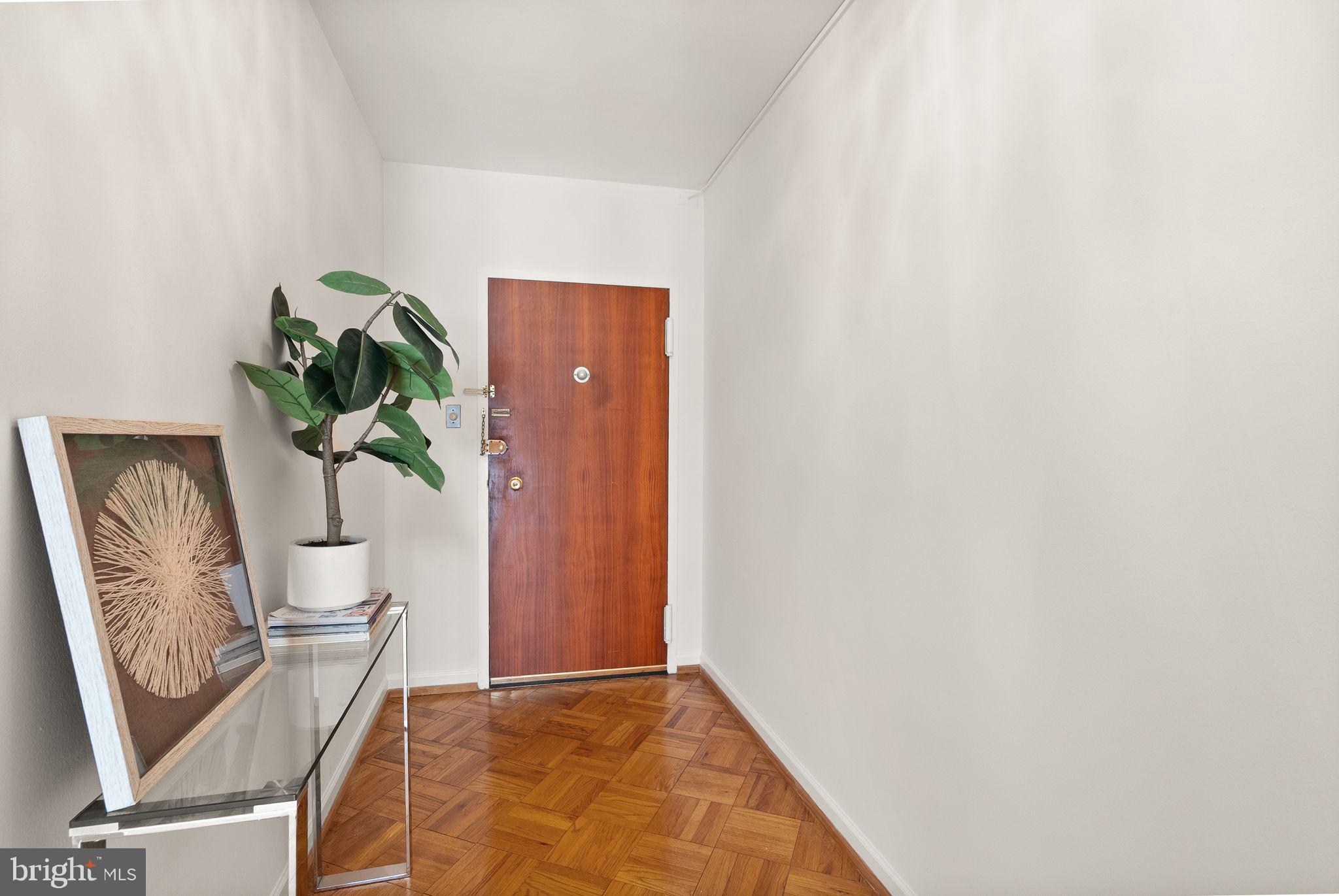 4200 Cathedral Avenue Northwest, Unit 812 Washington, DC 20016 - Photo 21 of 45 a view of hallway with paintings on the wall