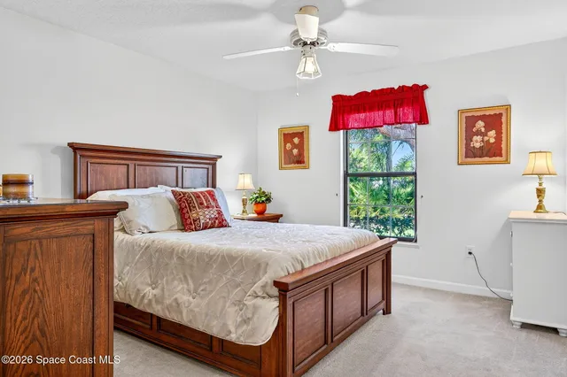 a bed room with a bed and a window