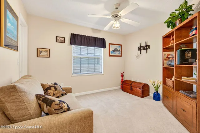 a bedroom with furniture and a window