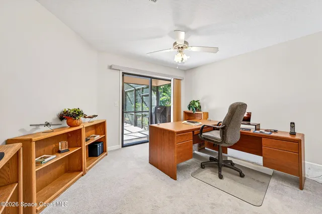 a workspace with furniture and a window
