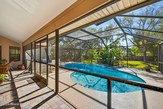 a view of a swimming pool with a patio