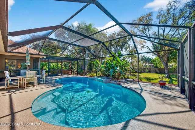 a view of a swimming pool with a patio