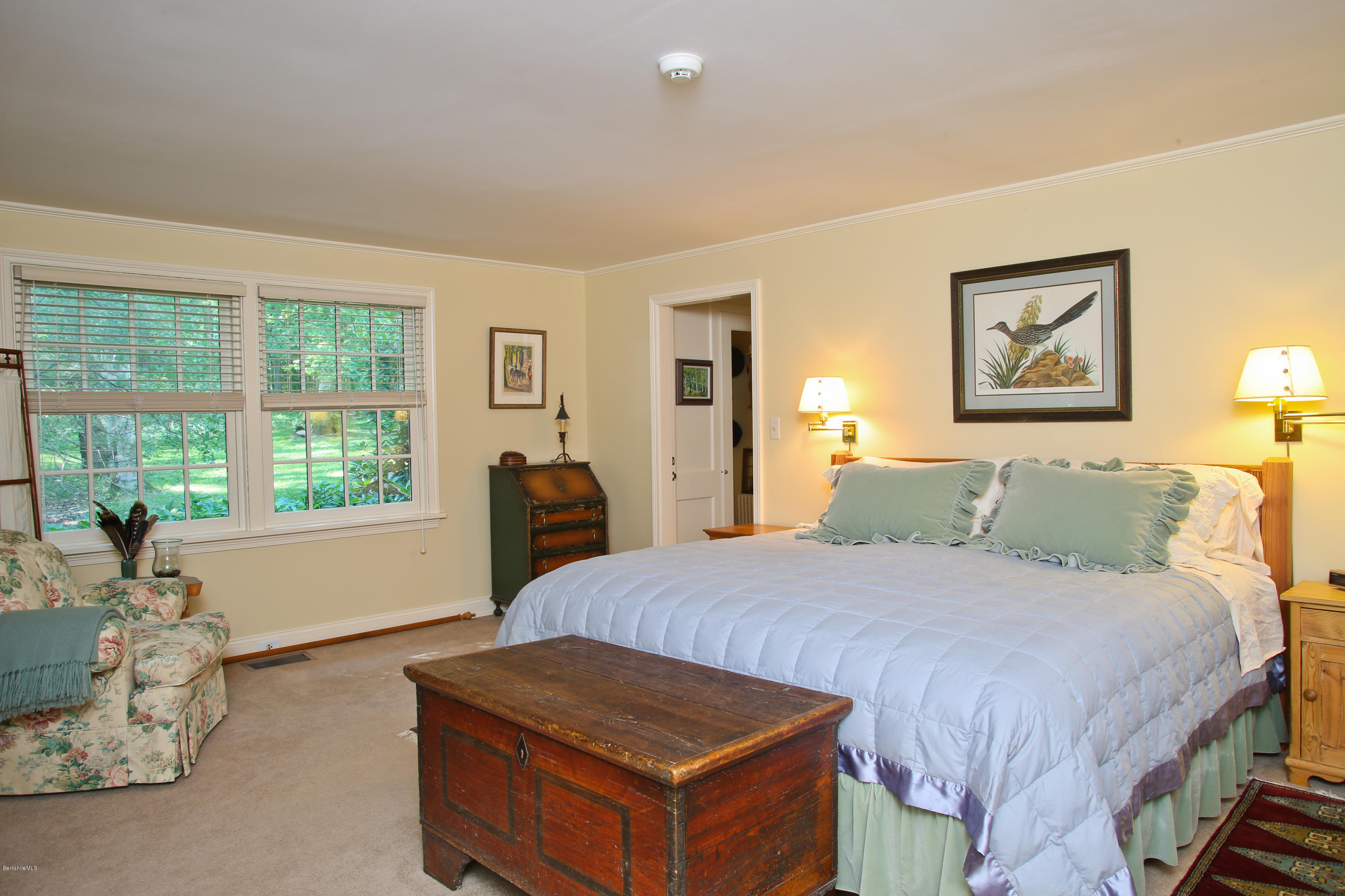 759 Hancock Road Williamstown, MA 01267 - Photo 16 of 71 a bed room with a bed and a chair