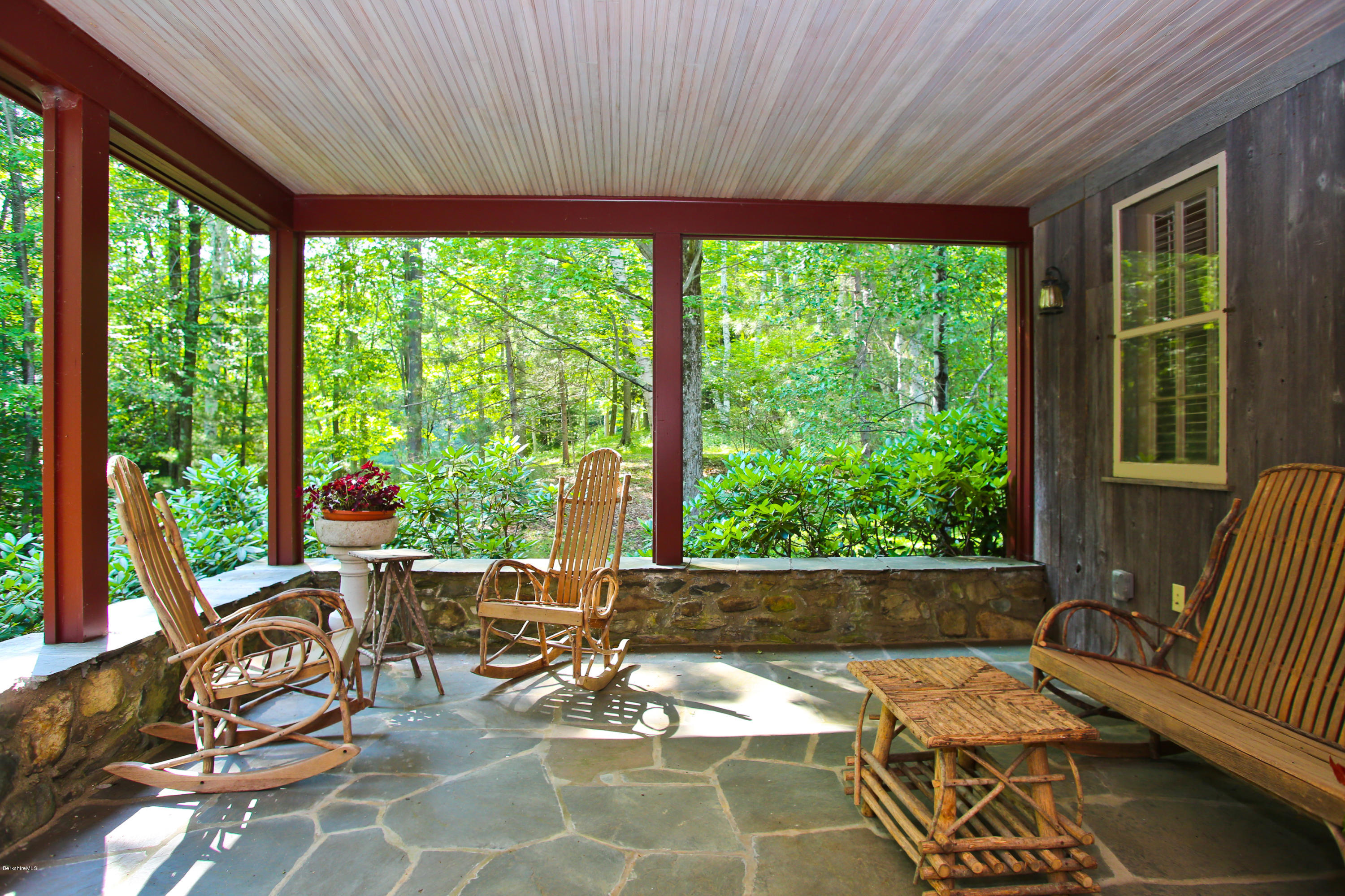 759 Hancock Road Williamstown, MA 01267 - Photo 17 of 71 a living room with patio furniture and floor to ceiling windows