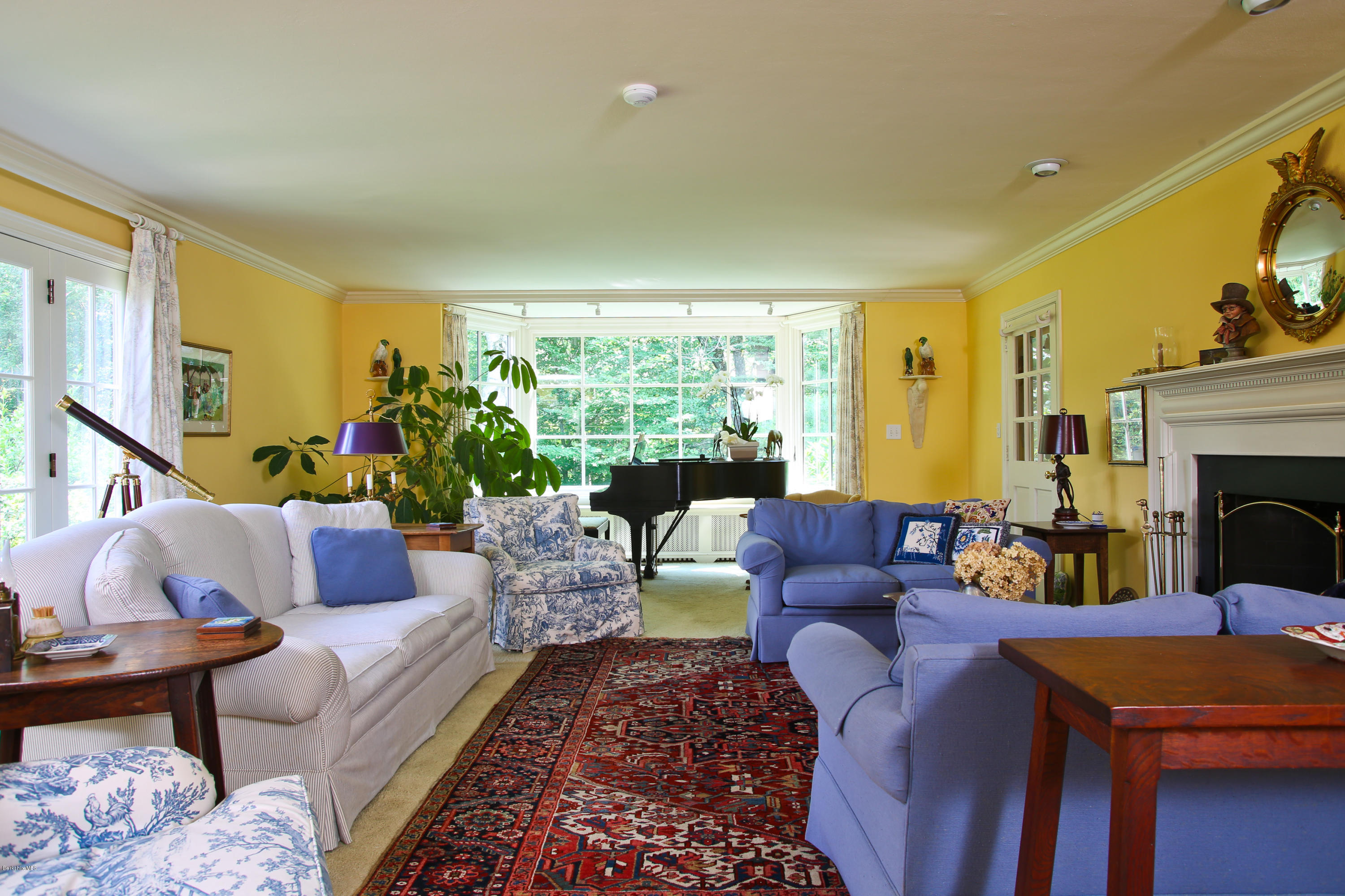 759 Hancock Road Williamstown, MA 01267 - Photo 21 of 71 a living room with furniture and a fireplace