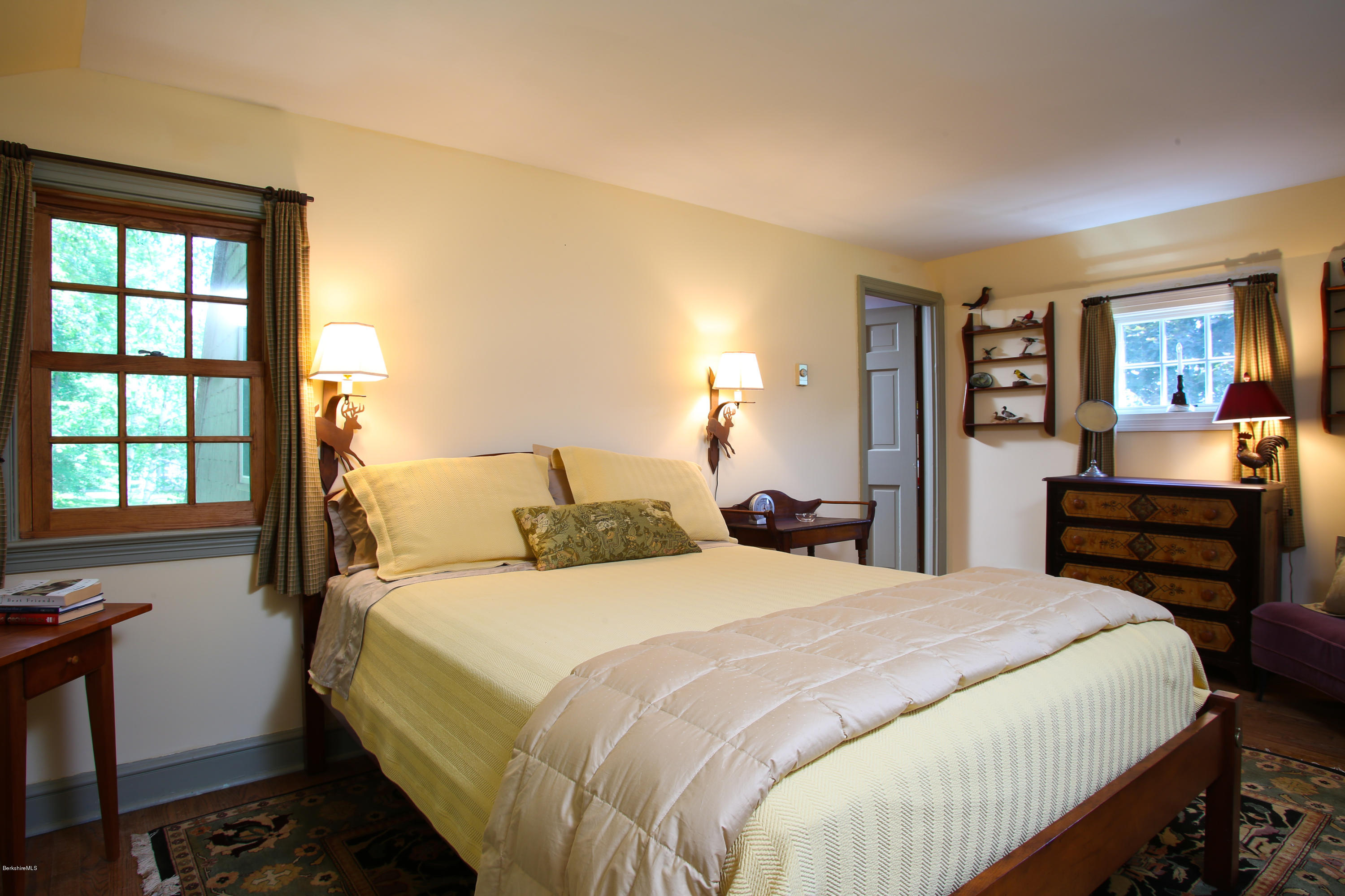 759 Hancock Road Williamstown, MA 01267 - Photo 28 of 71 a bedroom with a bed and wooden floor
