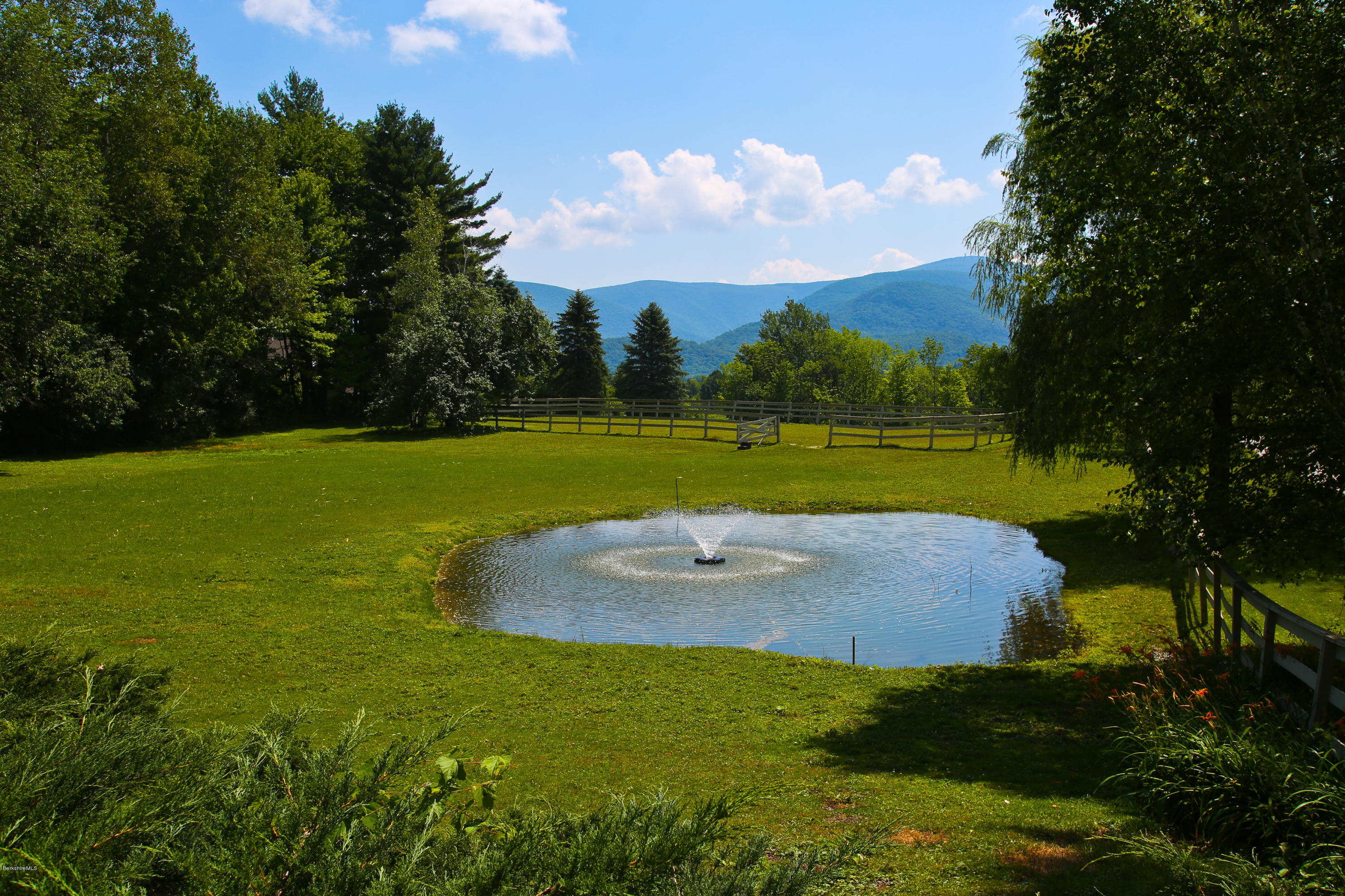 759 Hancock Road Williamstown, MA 01267 - Photo 42 of 71 a view of a golf course with a lake view