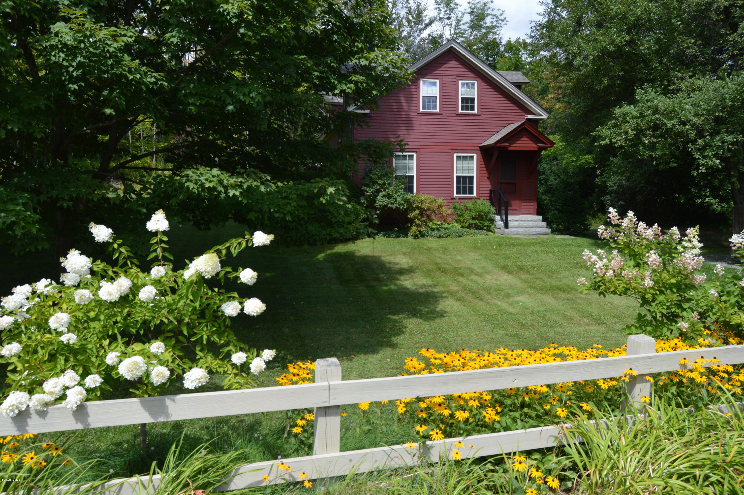 759 Hancock Road Williamstown, MA 01267 - Photo 57 of 71 a front view of a house with a yard