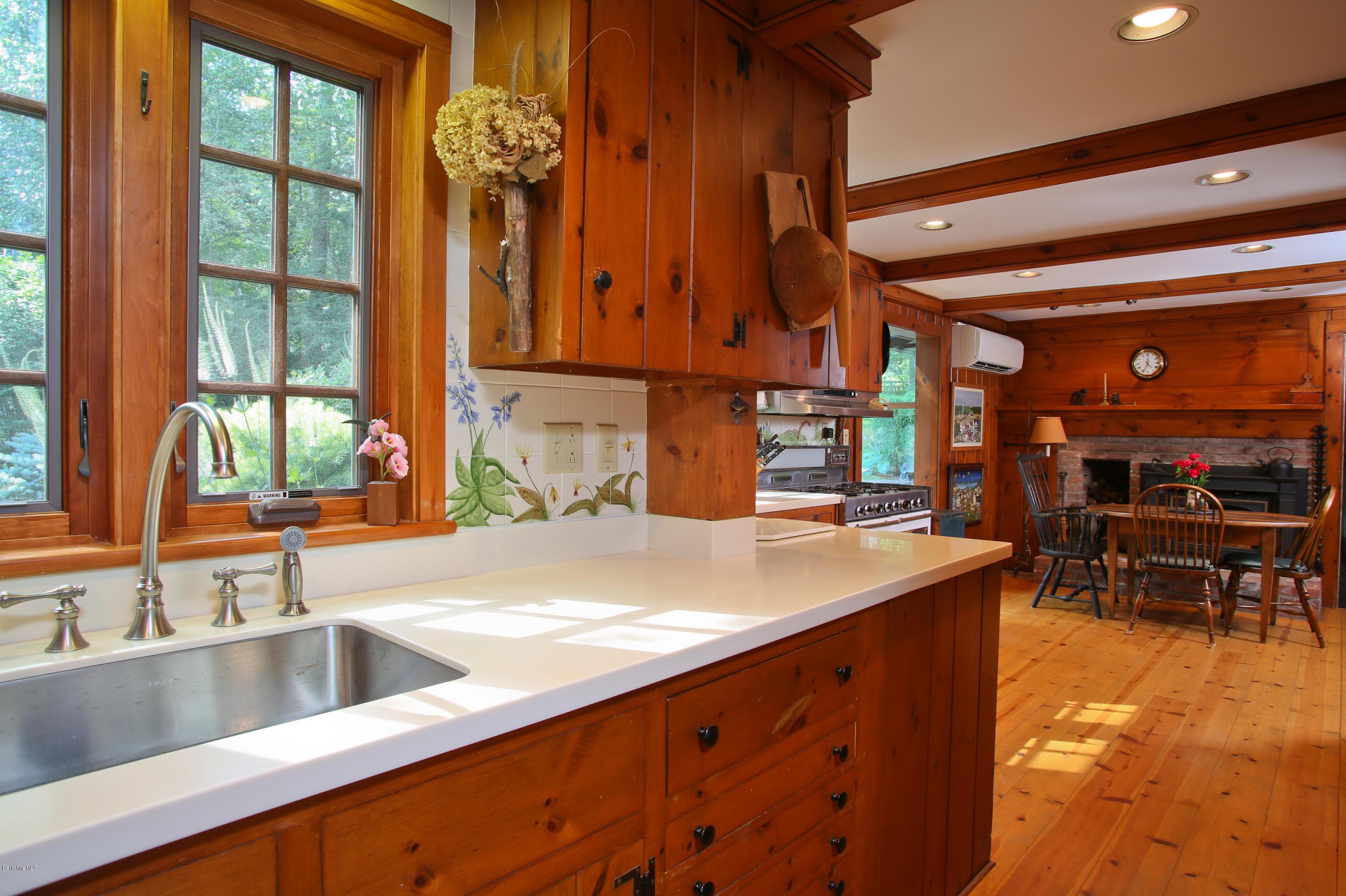 759 Hancock Road Williamstown, MA 01267 - Photo 9 of 71 a kitchen with stainless steel appliances a sink and a large window