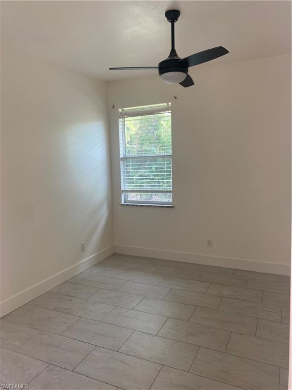 5314 30th Street Southwest Lehigh Acres, FL 33973 - Photo 11 of 19 a view of an empty room with a window