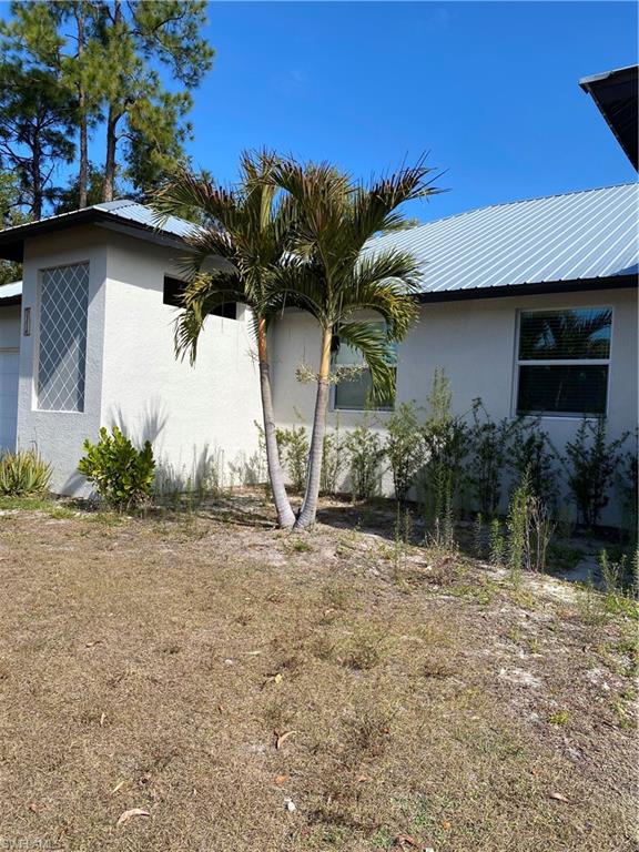 5314 30th Street Southwest Lehigh Acres, FL 33973 - Photo 2 of 19 a view of a house with a patio