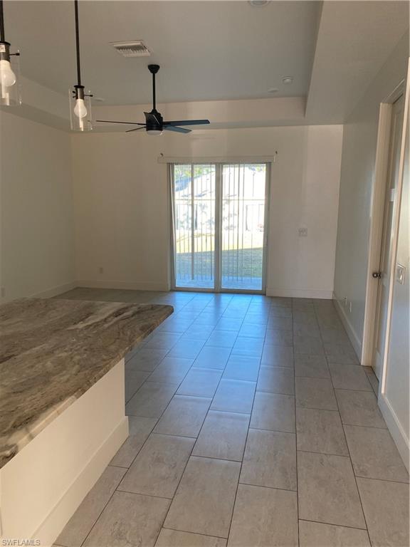 5314 30th Street Southwest Lehigh Acres, FL 33973 - Photo 4 of 19 a view of a kitchen with a sink and dishwasher wooden floor