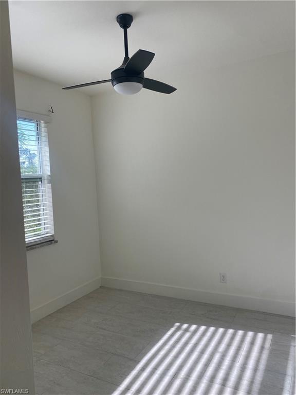 5314 30th Street Southwest Lehigh Acres, FL 33973 - Photo 7 of 19 a view of an empty room with a window