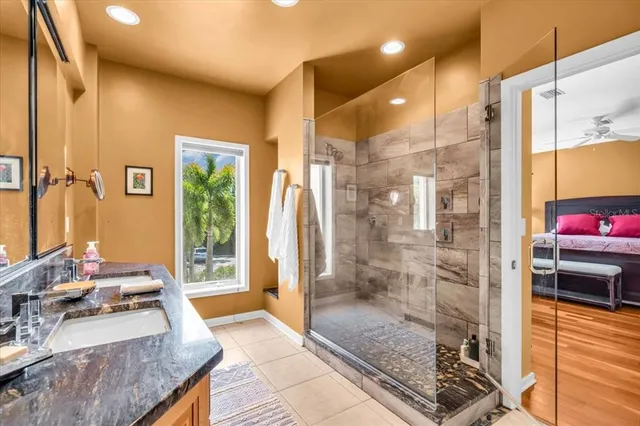 a bathroom with double sink and a mirror