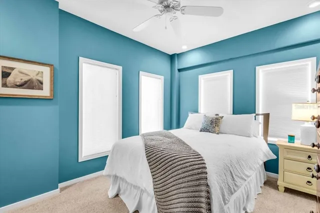 a bedroom with a bed and dresser