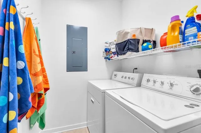 a view of walk in closet with clothes