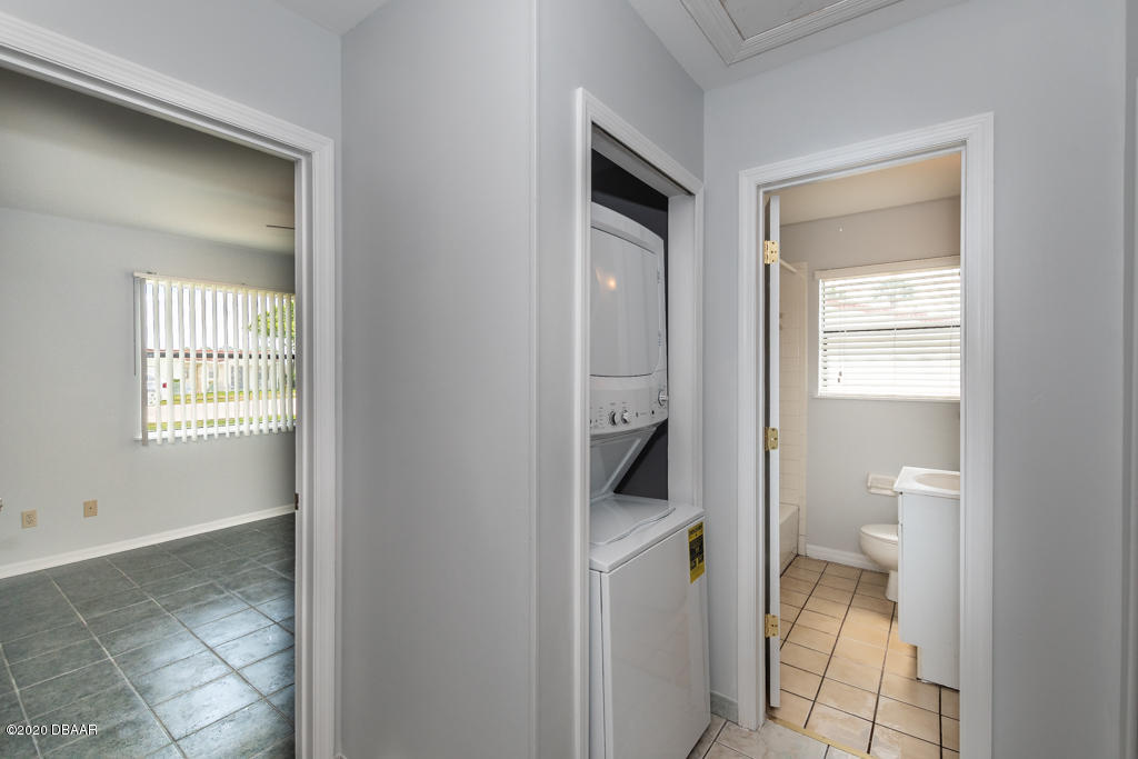 632 Robin Road, Unit A Ormond Beach, FL 32176 - Photo 12 of 15 hall with w/d