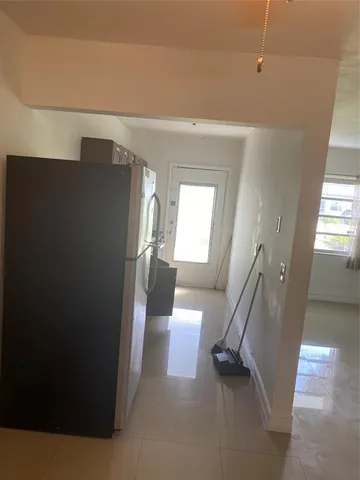 a view of a hallway with staircase