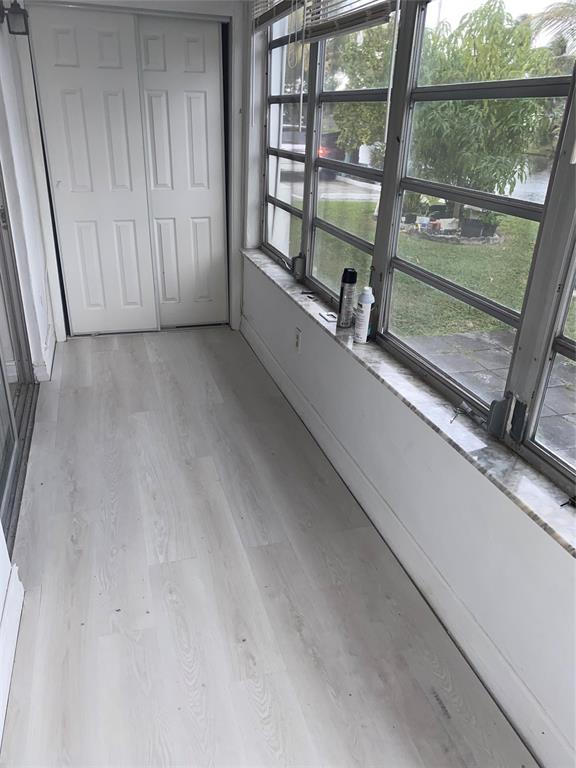 51 Northeast 204th Street, Unit 2 Miami, FL 33179 - Photo 9 of 18 a view of a room with a large window