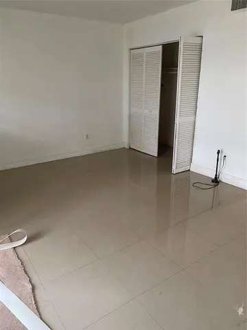 a view of a closet area with empty racks