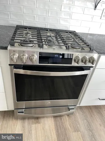 a bedroom with a bed and a cabinets