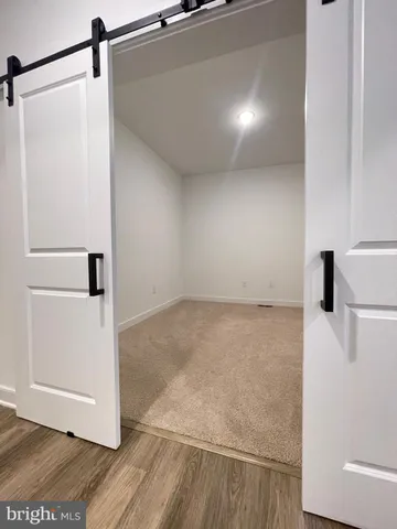 a bathroom with a double vanity sink and mirror