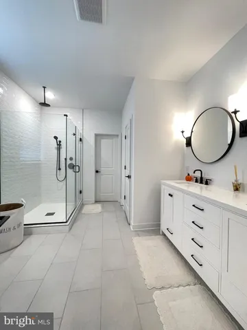 an aerial view of a house with outdoor space lake view and mountain view