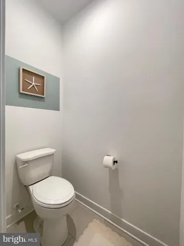 a view of a livingroom with workspace and a window