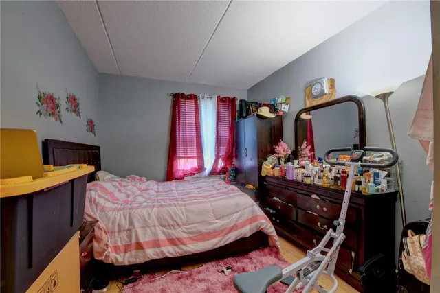 a bedroom with a bed and a table in it