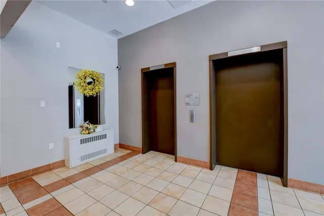 a view of a kitchen with cabinets and wooden floor