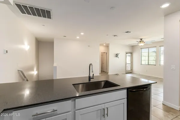 a kitchen with a sink and cabinets