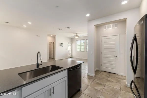 a kitchen with a sink and cabinets