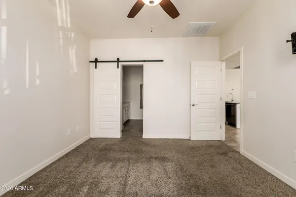 an empty room with closet and window