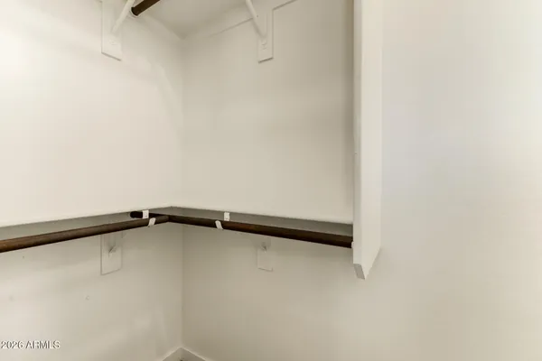 a bathroom with a tub sink shower and a mirror