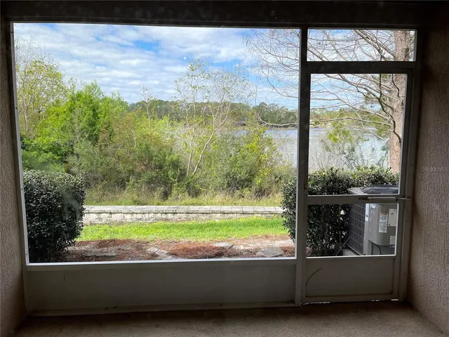 a view of a room with a large window