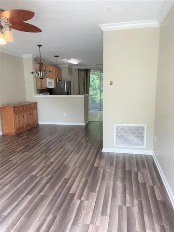 a view of kitchen and wooden floor