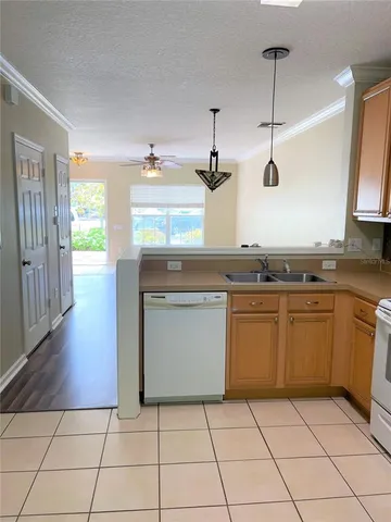 a kitchen with stainless steel appliances granite countertop a stove a sink and a granite counter tops