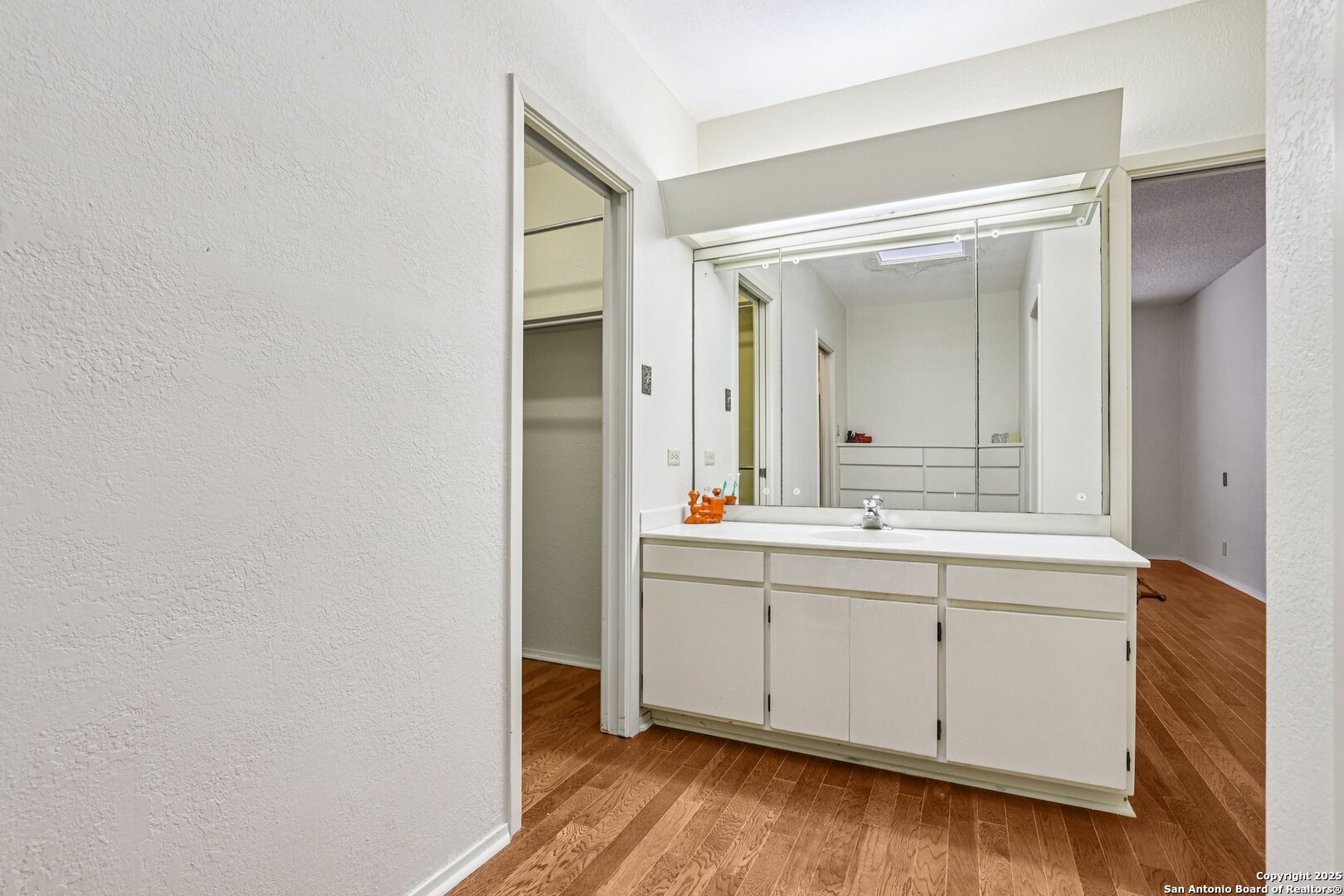 5817 Winding Ridge Drive Windcrest, TX 78239 - Photo 29 of 52 a bathroom with a sink and a mirror