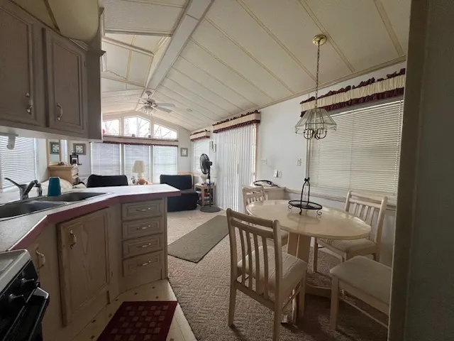 a kitchen with sink and cabinets