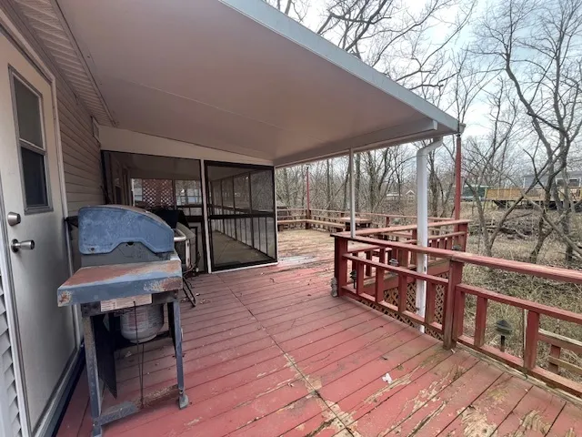 a view of a chairs and table in the balcony