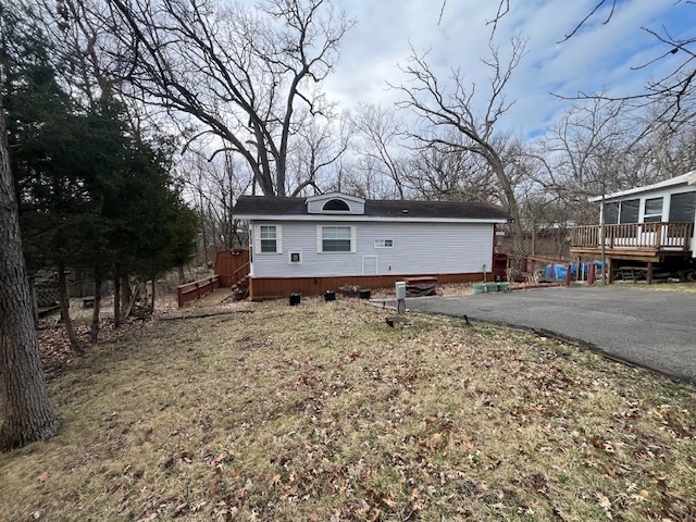 2795 East 28th Road Marseilles, IL 61341 - Photo 4 of 55 a front view of a house with a yard covered with snow and trees