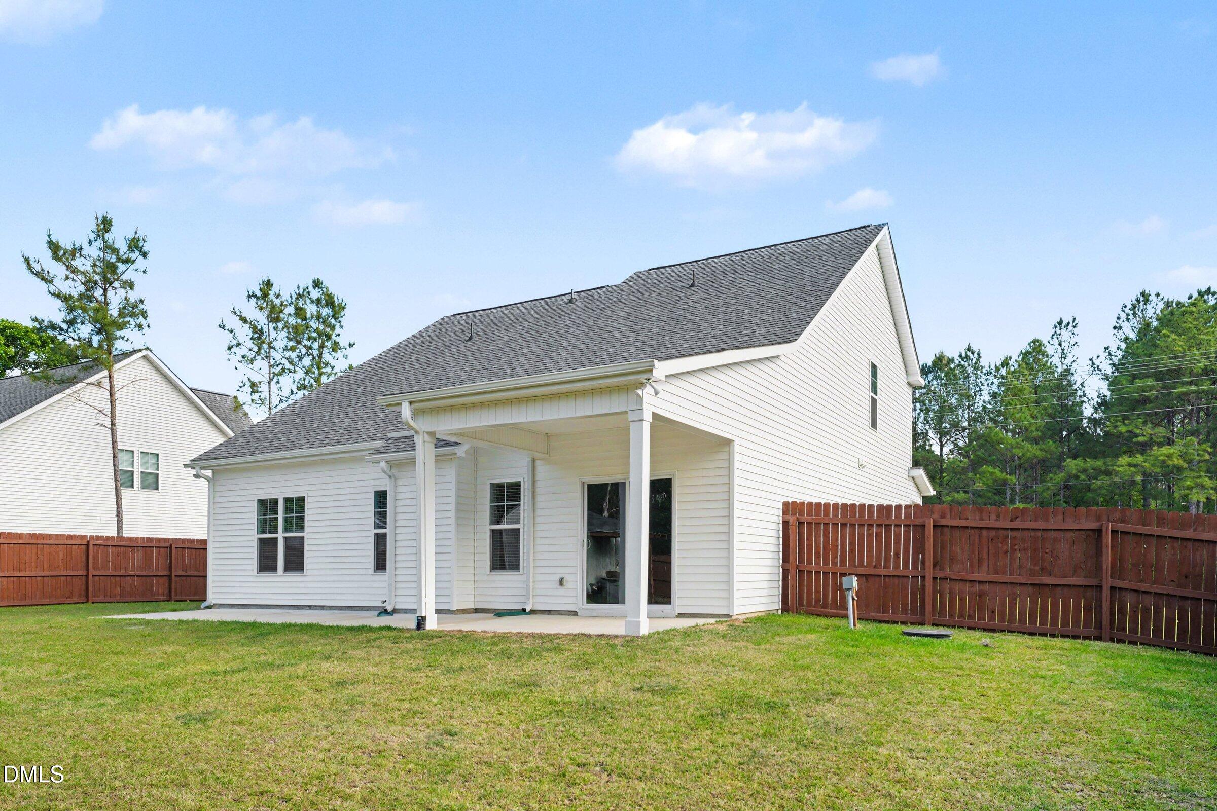 2815 Lemuel Black Road Spring Lake, NC 28390 - Photo 28 of 37 a view of a house with a yard and a porch