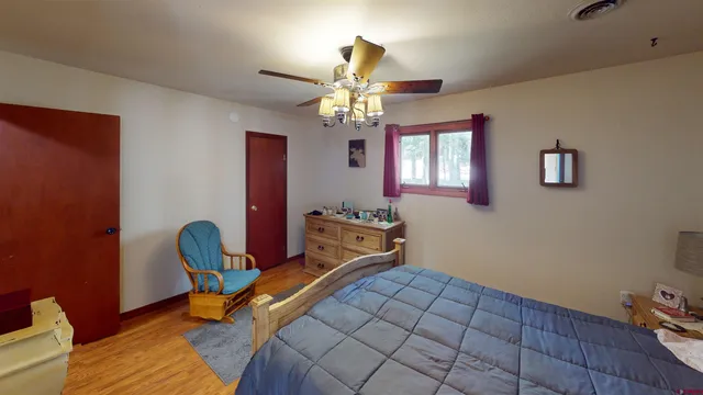 a bedroom with furniture and a chandelier